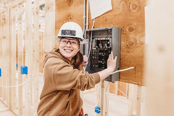 An electrical program student works in class